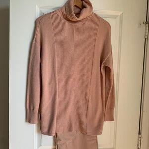 Salmon colored sweater and matching pants.